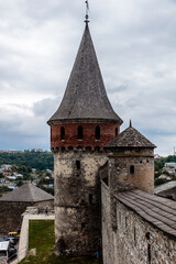 Fototapeta premium A tall brick tower with a pointed roof