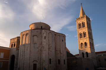 Fototapeta premium Old cathedral with bell tower on a sunny day
