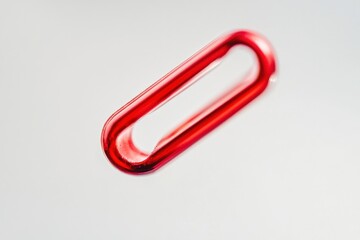 Obraz premium a red plastic link on a white background