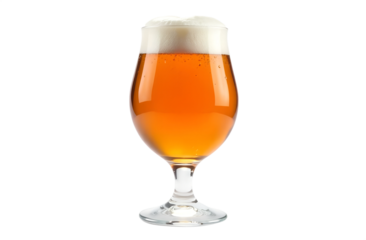Bright golden beer served in a tulip glass with frothy top in a minimalist setting