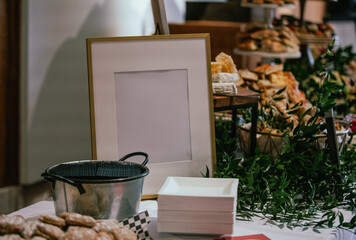 view of a table top with an empty white frame during an event