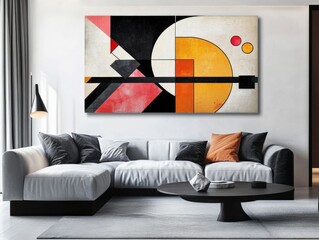Abstract geometric painting above a gray sofa in a living room.