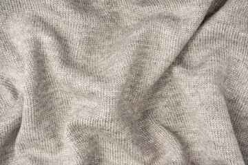 Grey wool sweater texture as a background.