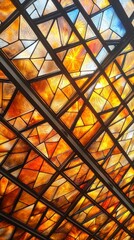 A vibrant stained glass ceiling featuring a mosaic of orange, yellow, and blue hues, creating a stunning artistic effect.