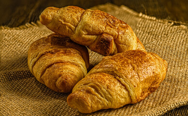 Freshly Baked Croissants on Burlap Surface