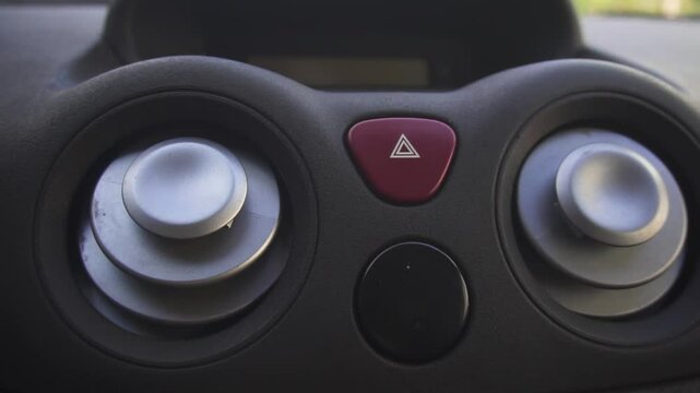 A closeup view of a part of the interior of car with a view of the ventilation round deflector of the stove for heating and cooling