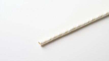 a single paper straw on a white background
