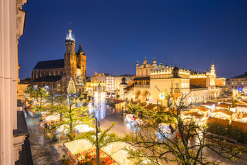 View of the Krakow Christmas Market 2024 and the historic Old Town Square, beautifully illuminated with festive lights and vibrant holiday atmosphere.