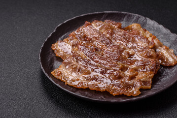 Crispy fried pork bacon sliced with salt, spices and herbs