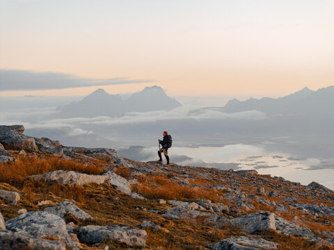 Embark on a stunning mountain hike at sunrise, taking in breathtaking scenic views all around