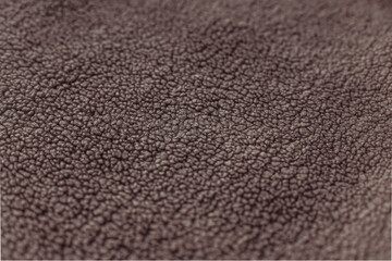 Color of the Year 2025 Mocha Mousse color. Chocolate or Brown Background. Close-Up of Brown Textured Wool Surface with Dense Abstract Patterns