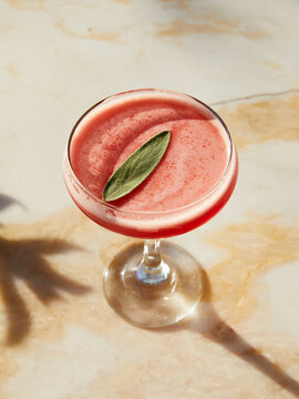 Gin cocktail with Elderflower Liqueur, Raspberry & Fresh Sage and Lemon