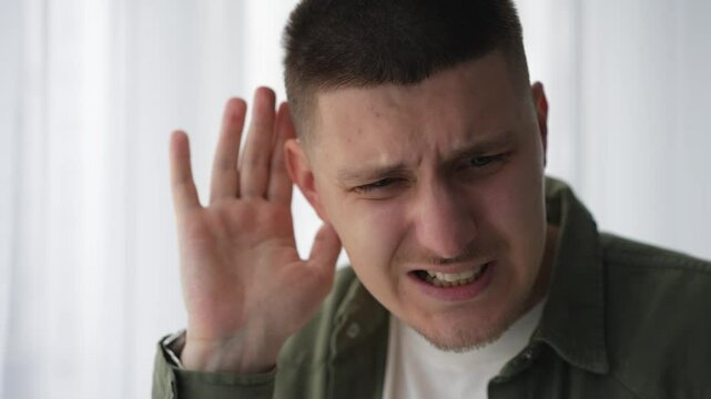 Hearing problems.
A man with poor hearing.
A man cannot hear when people speak quietly.
The man has an ear injury.