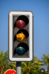 yellow directional traffic light