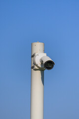 Security camera on pole in city center