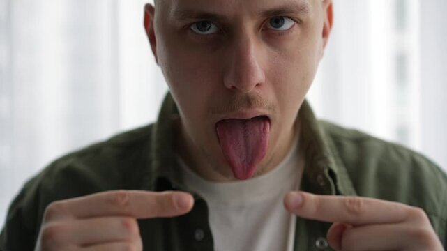 Mouth facial expressions.
A man warms up his speech apparatus.
Massage your mouth before a performance.
Oratory art.
The announcer stretches his mouth for clear diction