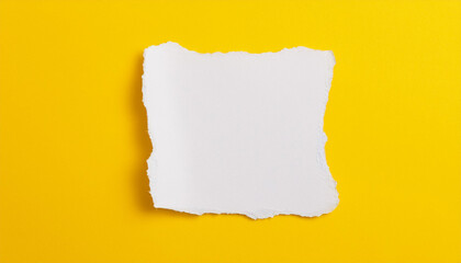 White paper with torn edges on yellow background. Note paper for message. Top view. Mock-up.