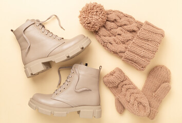 Winter accessories on color background, top view