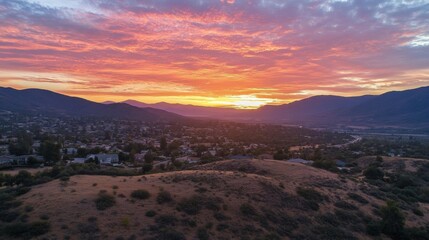 an aerial view of a city at sunrise