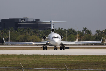 A classic cargo plane lining up runway 9 at Miami International Airport