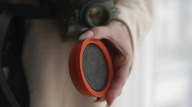 Cleaning the apartment.
A vacuum cleaner is in the hands of a girl.
A clogged paralon filter in the hands of a girl.
Disassembled vacuum cleaner in hands