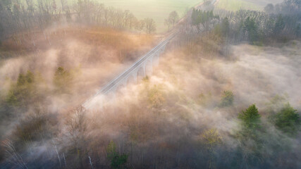 Chýnov Bridge at sunrise in the morning fog. Granite viaduct built in the village of Chýnov in...