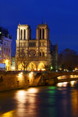Fototapeta premium Notre Dame Cathedral in Paris will reopen following a five-year restoration after the 2019 fire. The cathedral will feature a rebuilt spire, restored interiors, and preserved historical elements.