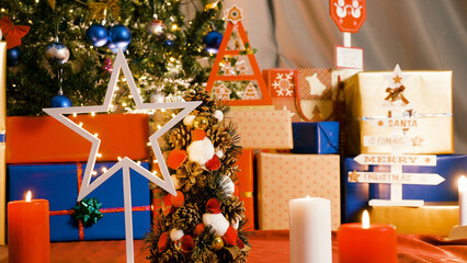 Still image of a dolly shot moving left to right, showcasing a beautifully decorated Christmas tree with garlands. Perfect for Merry Christmas and Happy New Year celebrations