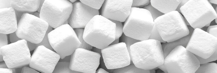 Close up view of white sugar cubes creating a textured arrangement suitable for baking and cooking