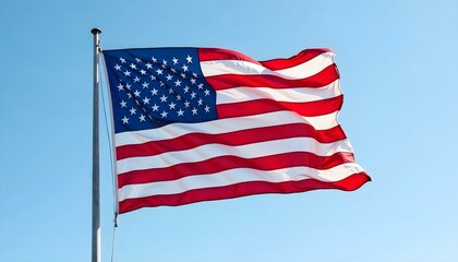 Obraz premium Vibrant United States Flag Waving Under a Clear Blue Sky in High Resolution