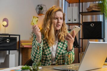 Caucasian angry mad stressed freelancer try to pay online shopping with laptop blocked credit card....