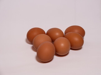 Organic eggs on white background