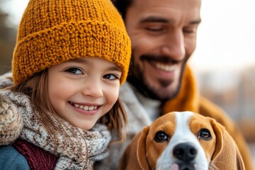 Smiling child and father enjoying autumn outdoors with a friendly dog in a cozy park setting
