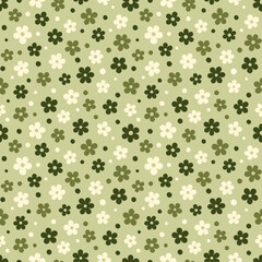Vector seamless pattern with stylized olive flowers and dots. Minimalist style. Green shades of elements on olive background. The simple design is perfect for nature concept, textile and packaging