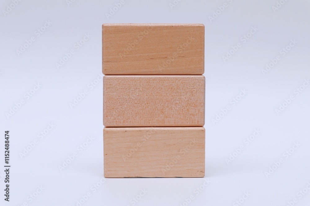 Fototapete stack of empty wooden blocks for written text on white background