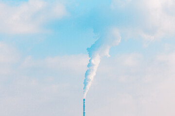 Factory chimney releasing smoke into the atmosphere. Smoke billowing from a industrial pipe,...
