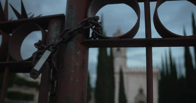 Close door with lock and former franciscan convent behind