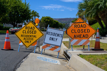 Road closures and public works due to ongoing land movement in upscale neighborhood Rancho Palos Verdes, California.
