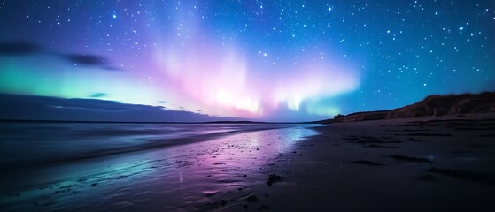 Naklejka premium Aurora borealis over a tranquil beach at night.