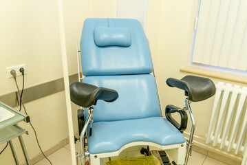 Interior of gynecologist office hospital, bright room with medical equipment