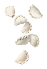 Raw dumplings (varenyky) in air on white background