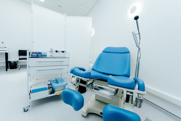 Interior of gynecologist office hospital, bright room with medical equipment