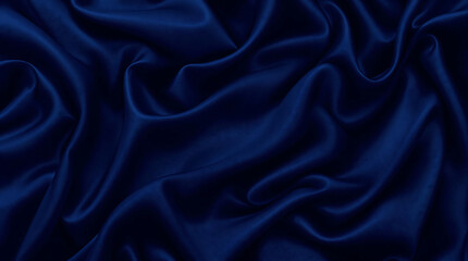 Fototapeta premium Luxurious dark blue satin fabric with elegant folds, drapes, and a smooth texture. Ideal for backgrounds, product displays, or designs related to fashion and elegance.