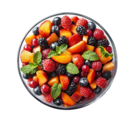 Bowl of colorful fresh fruit salad with mint leaves, vibrant mix of strawberries, blueberries, raspberries, and mangoes, healthy dessert isolated on transparent background