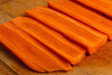Cut carrots flat slice as background for healthy eating concept