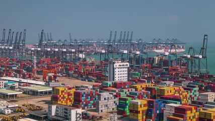 SHENZHEN, CHINA - NOVEMBER 7, 2024 Overview of busy shipping containers and ports in bustling Shenzhen, showcasing trade and logistics activity
