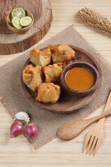 batagor,is a street food that is very popular in Indonesia.made from fish, tapioca and seasoning wrapped in dumplings then fried. Served with spicy peanut sauce. photographed with studio light