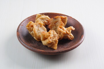 batagor,is a street food that is very popular in Indonesia.made from fish, tapioca and seasoning wrapped in dumplings then fried. photographed with studio light