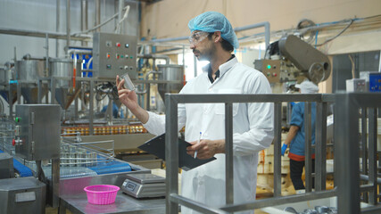 Production control supervisor inspects and controls the operation of each step in the production...