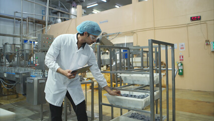 Production control supervisor inspects and controls the operation of each step in the production...